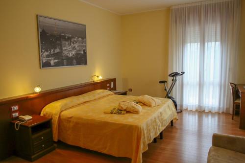 Krevet ili kreveti u jedinici u okviru objekta Hotel Terme Vena D'Oro
