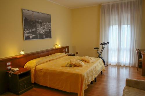 Postel nebo postele na pokoji v ubytování Hotel Terme Vena D'Oro
