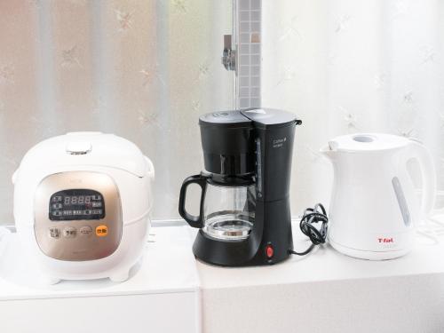 a coffee maker and a blender on a counter at Villa Suite HANA 2Bed room まるまる1棟貸切#北部観光に最適な立地 in Nago