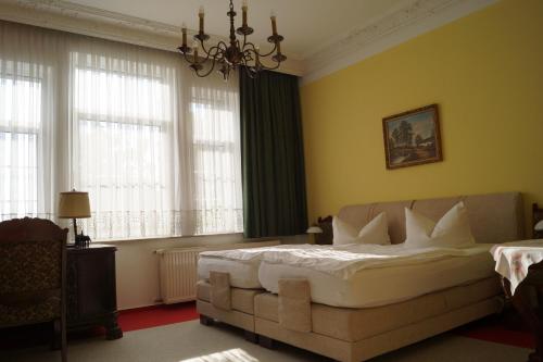 Ένα ή περισσότερα κρεβάτια σε δωμάτιο στο Hotel Villa Wittstock