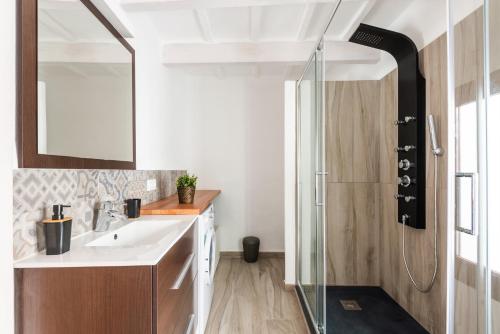 a bathroom with a sink and a shower at SA CASETA in Ciutadella