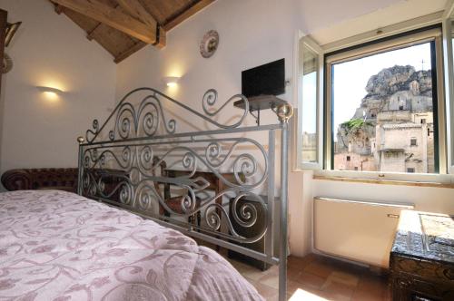 Ένα ή περισσότερα κρεβάτια σε δωμάτιο στο Agli Archi Dimore Storiche