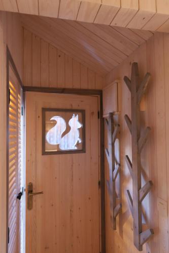 a room with a door and a cross on the wall at Douar Samra in Imlil