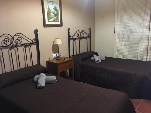 Cama o camas de una habitación en Apartamentos El Silo