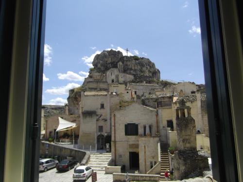 a view of a mountain from a window at Agli Archi Dimore Storiche in Matera