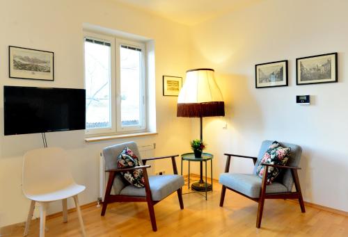 TV a/nebo společenská místnost v ubytování House With Courtyard & Parking Close To Stadtpark