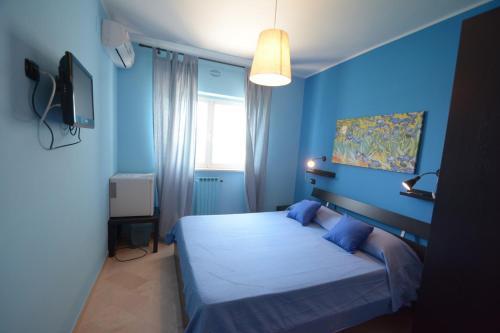 Postel nebo postele na pokoji v ubytování B&B LA BAIA Sea Rooms