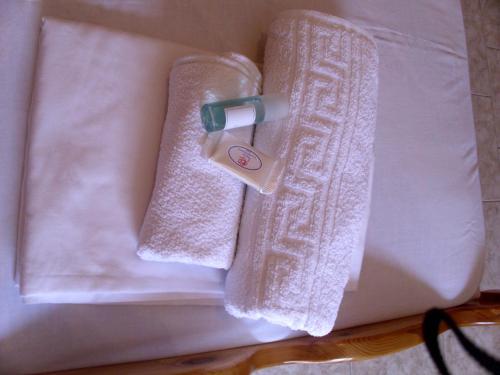 a pair of towels sitting on top of a table at Dafni Studios in Neo Klima