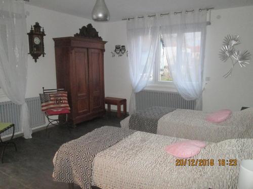 Postel nebo postele na pokoji v ubytování Gîte du Coq
