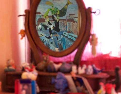 a mirror with a reflection of a superhero in it at Azienda Agricola Il Querceto in Marsico Vetere