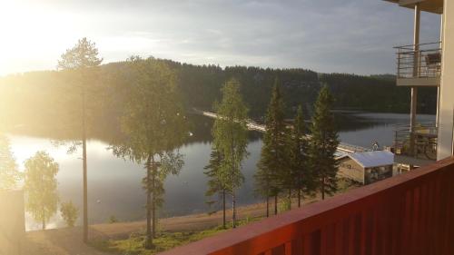a view of a lake from a balcony of a house at SKIVILLAS 61 UKKOHALLA in Hyrynsalmi