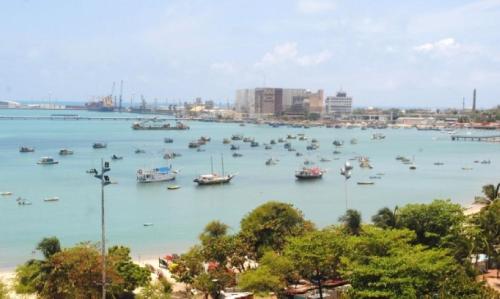 a large body of water with boats in it at Iracema Residence Hotel Flat in Fortaleza