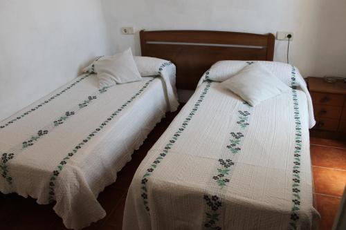 Un ou plusieurs lits dans un hébergement de l'établissement Hostal Graciela