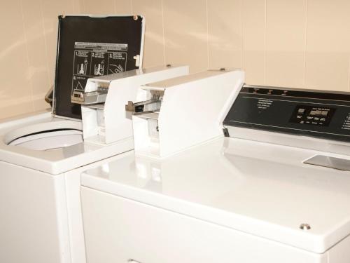 a white counter with a sewing machine on it at Top Notch Inn in Gorham