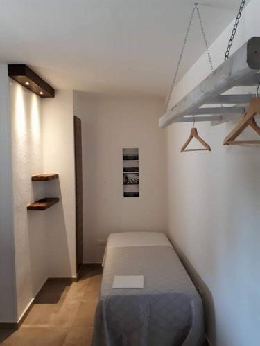 a bedroom with a bed in a room at Masseria Nzeta in Carovigno