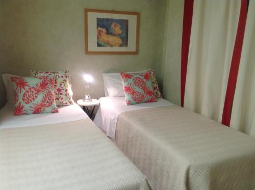 Postel nebo postele na pokoji v ubytování Mare Nostrum Petit Hôtel