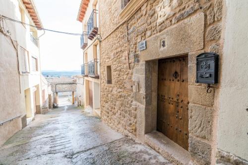 an alley in an old stone building at Casa rural Rosa in La Fresneda