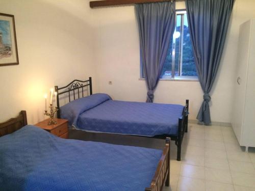 A bed or beds in a room at House with Sea View close to Platanias