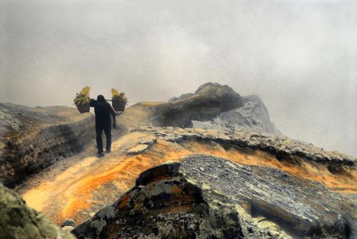a man walking up the side of a mountain at Hotel Al Togo Fitness & Relax in Vulcano