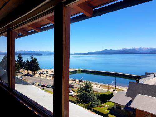 a view of the water from a window at Hotel Flamingo in San Carlos de Bariloche
