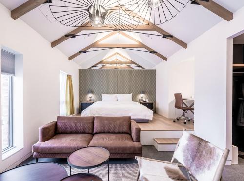 a bedroom with a bed and a couch at Patio 7 in Seoul