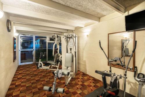 a room with a gym with two tread machines at Days Inn By Wyndham Carlisle North in Carlisle