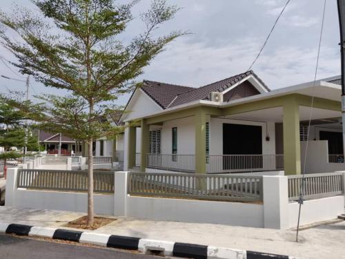 a house on the side of a street at AZ Homestay Bertam Perdana With Free Wifi in Kepala Batas