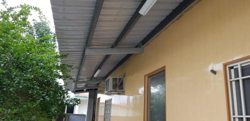 awning on the side of a house at 月眉民宿 in Yuemei