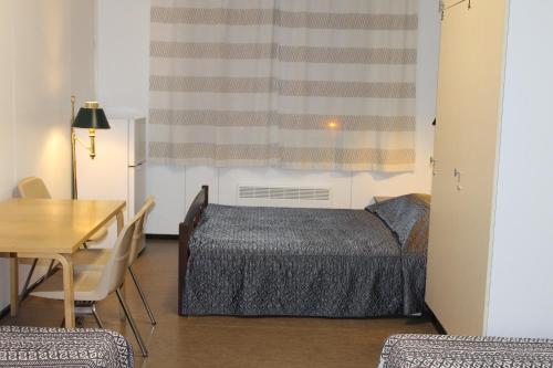 Ένα ή περισσότερα κρεβάτια σε δωμάτιο στο Guesthouse - Kuin Kotonaan