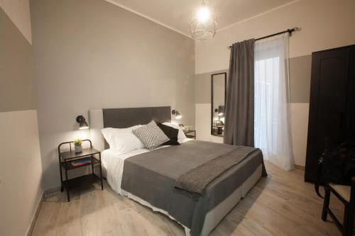 Tempat tidur dalam kamar di 6th Land - Rent Rooms Affittacamere