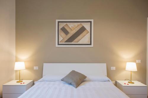 Ένα ή περισσότερα κρεβάτια σε δωμάτιο στο Piazza Paradiso Accommodation