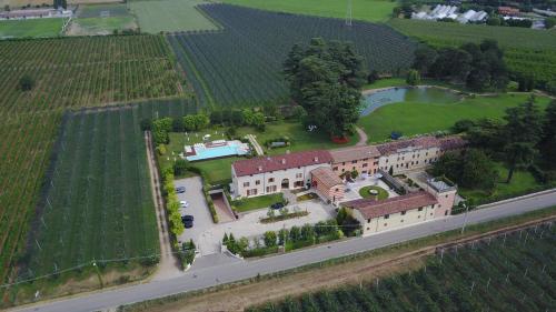an aerial view of a large house with a yard at Belvivere Suites in Sona