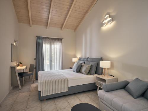 Ένα ή περισσότερα κρεβάτια σε δωμάτιο στο San Giorgios Maisonettes