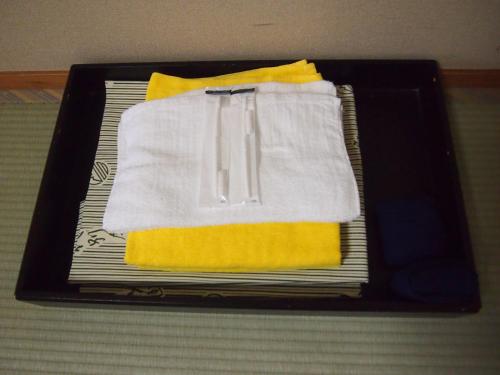 a tray with towels and napkins on a table at Tashiro Annex in Yakushima