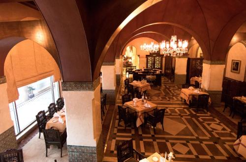 an overhead view of a restaurant with tables and chairs at Islamabad Serena Hotel in Islamabad
