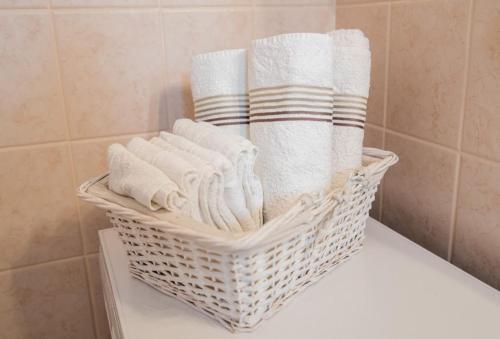 a basket of towels sitting on top of a counter at Apartments Petranic in Supetar