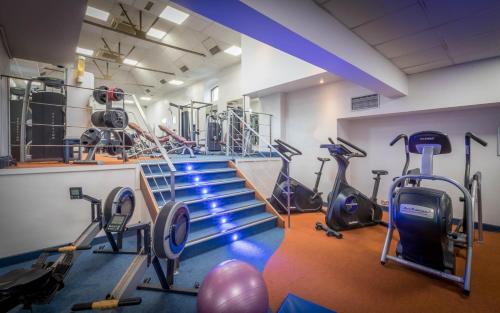 a gym with treadmills and exercise equipment in a room at Talbot Hotel Wexford in Wexford