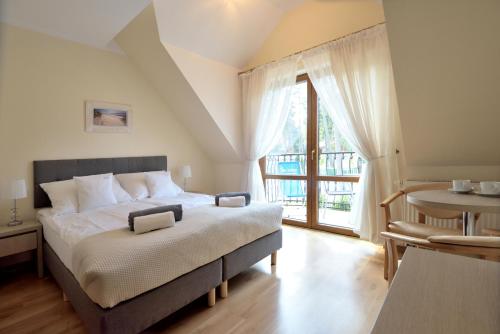 Säng eller sängar i ett rum på Villa Szelega
