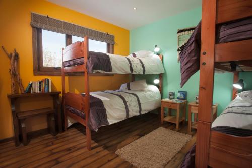 A bunk bed or bunk beds in a room at The Singing Lamb
