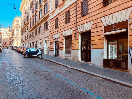 a car parked on a street next to a building at Roma Trasteverina in Rome