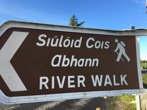 a sign that reads school crossings at alhamimaru riverwalk at Annie's River Retreat in Doochary