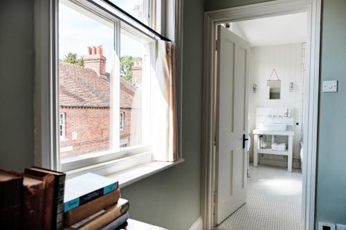 an open window in a room with a view at Bel and The Dragon-Kingsclere in Kingsclere