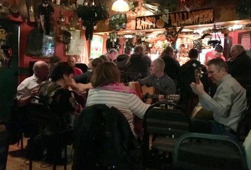 a group of people sitting in a bar at Annie's River Retreat in Doochary