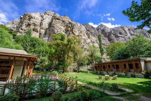 a resort with a mountain in the background at Serena Shigar Fort in Shigar