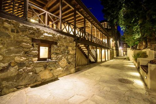 a stone building with a stone wall and a stairway at Serena Shigar Fort in Shigar