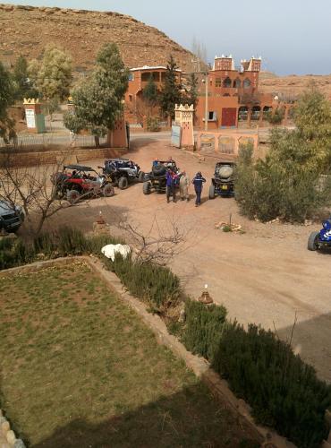 a group of cars parked in a parking lot at Auberge Camping BOUGAFER Tamtetoucht in Tamtetoucht