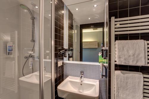 Koupelna v ubytování MEININGER Hotel Berlin Airport