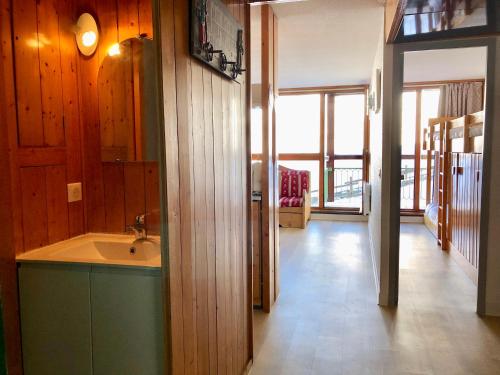 a bathroom with a sink and a large window at Arcadien - Appartement les Arcs 1800 - 10 personnes - 3 chambres in Arc 1800