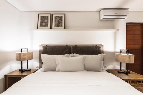 מיטה או מיטות בחדר ב-Casa Amarela