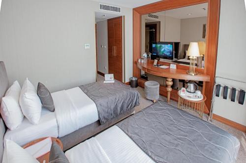 Postel nebo postele na pokoji v ubytování Nowy Efendi Hotel - Special Category